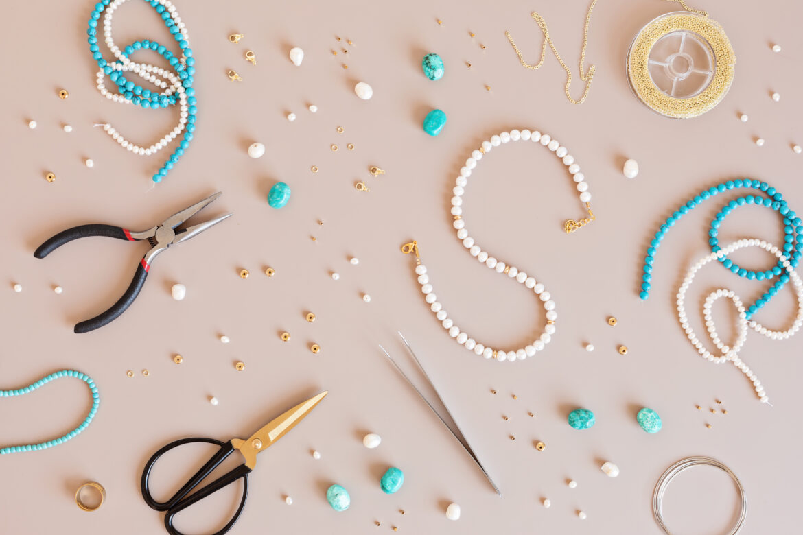 Jewelry making flatlay with semi-precious stone beads and tools